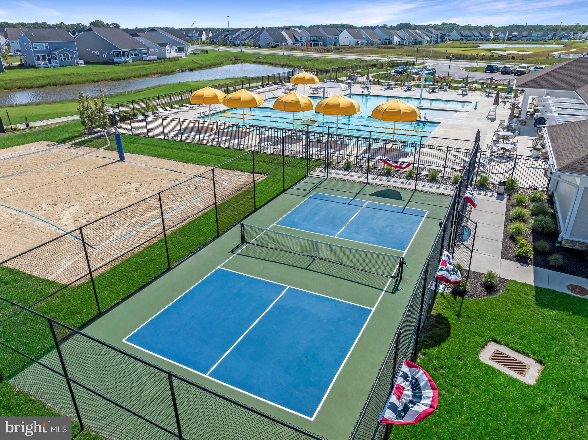 36046 Auburn Way Millsboro, DE 19966 - Photo 48 of 56 a view of a tennis ground with large trees