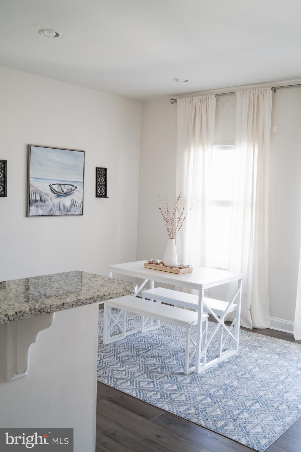 36046 Auburn Way Millsboro, DE 19966 - Photo 5 of 56 a living room with a couch and a table