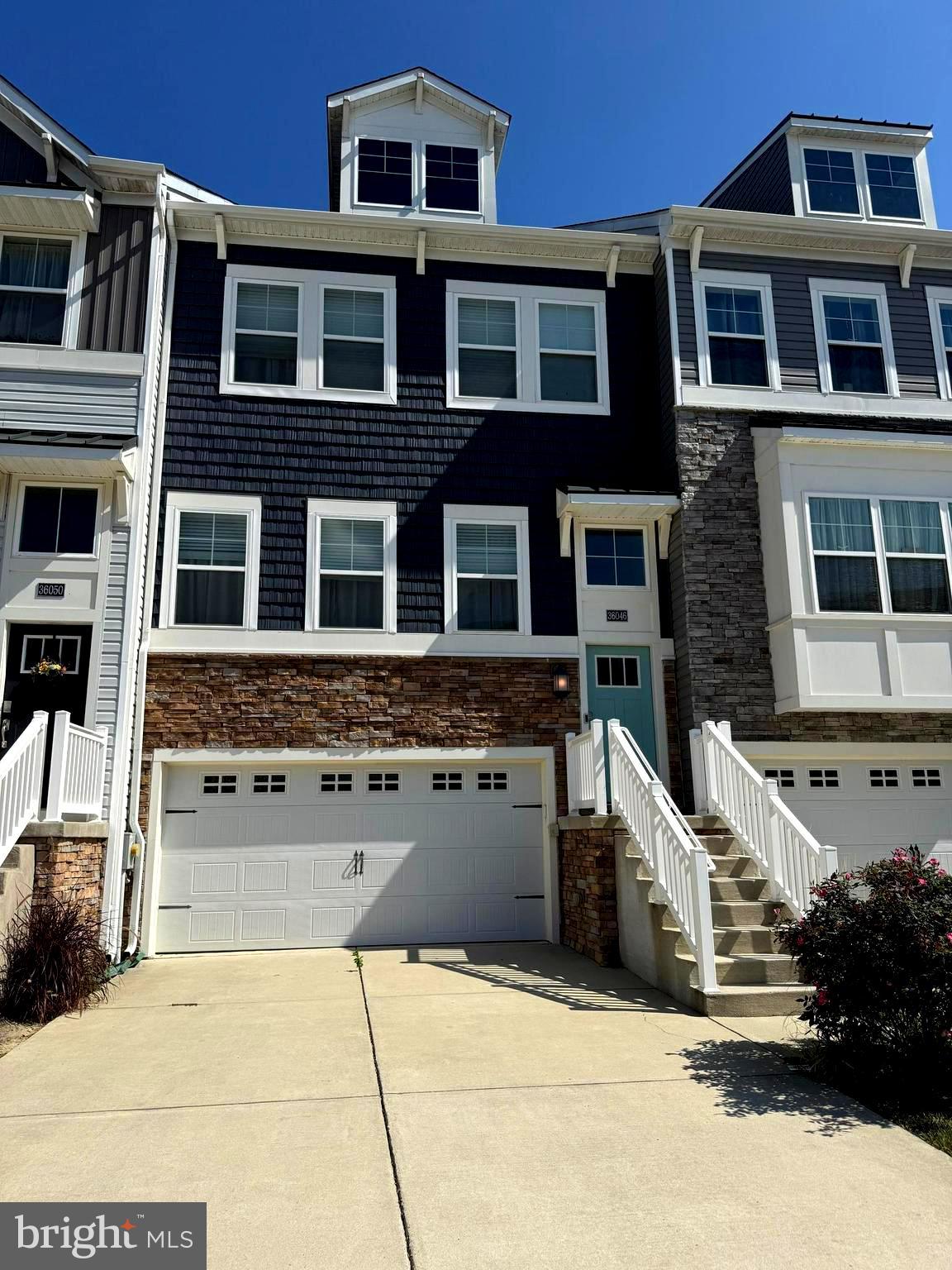 36046 Auburn Way Millsboro, DE 19966 - Photo 55 of 56 a front view of a building with many windows