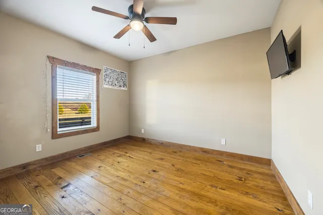 a view of large house with a big yard and potted plants