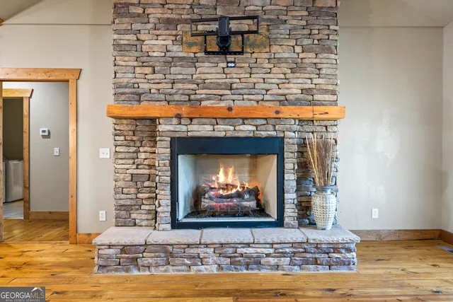 a view of a house with wooden walls and floor to ceiling windows