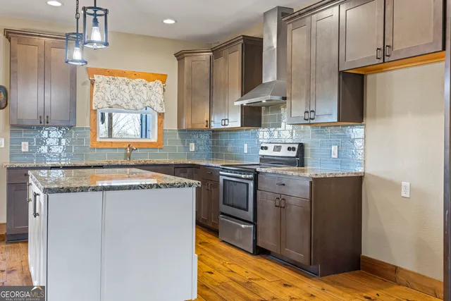 a front view of a house with yard and porch