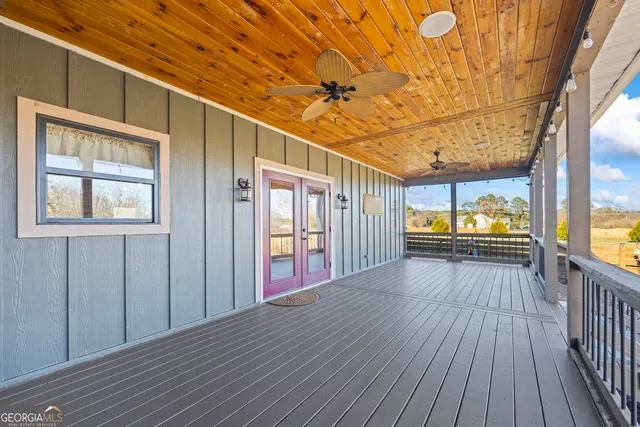 swimming pool view with a seating space
