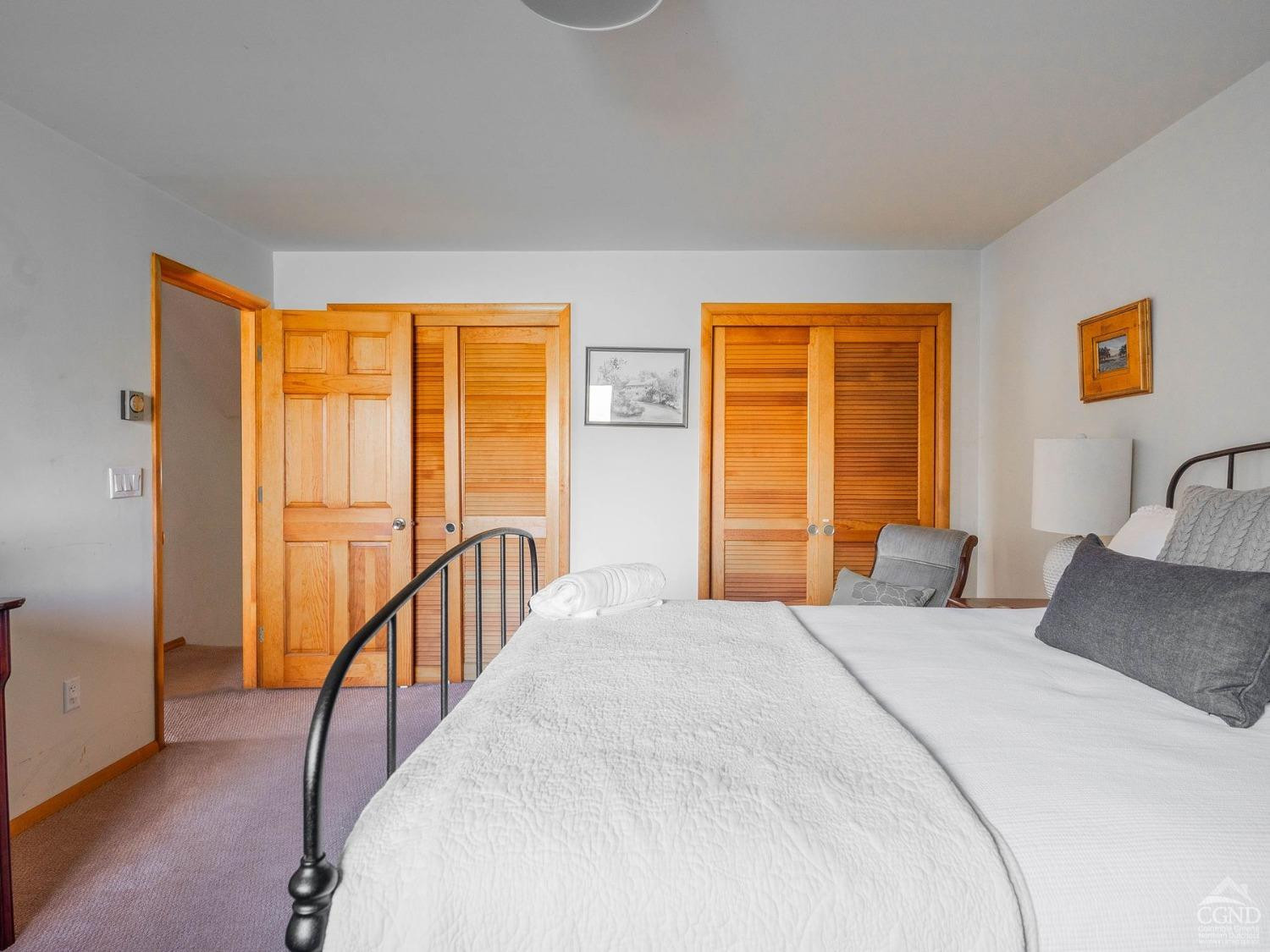 266 Siam Road Windham, NY 12496 - Photo 14 of 52 a bedroom with a bed and glass windows