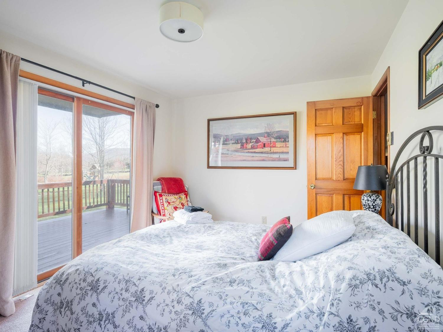 266 Siam Road Windham, NY 12496 - Photo 16 of 52 a bedroom with a large bed and a large window