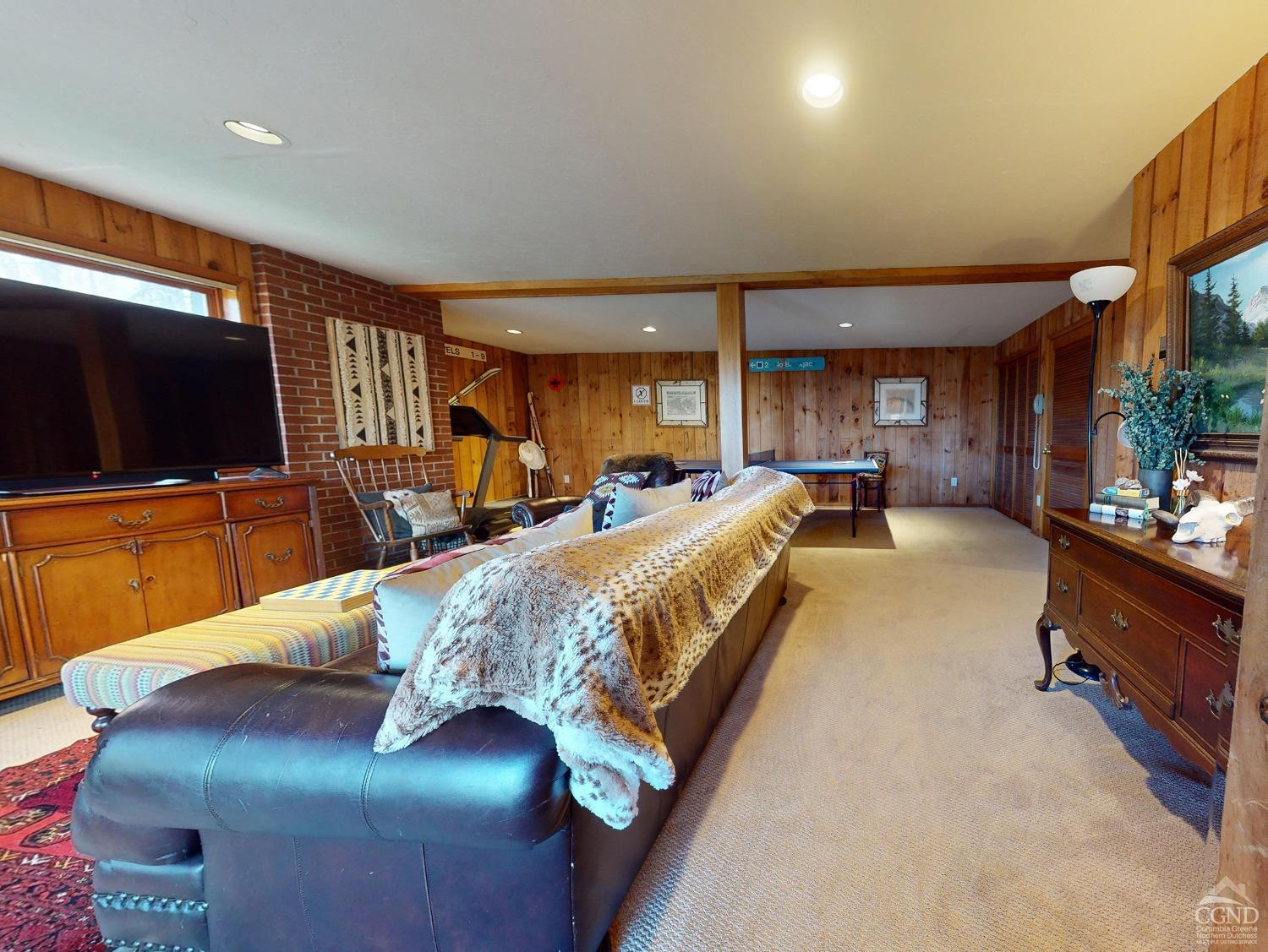 266 Siam Road Windham, NY 12496 - Photo 26 of 52 a living room with furniture and a flat screen tv