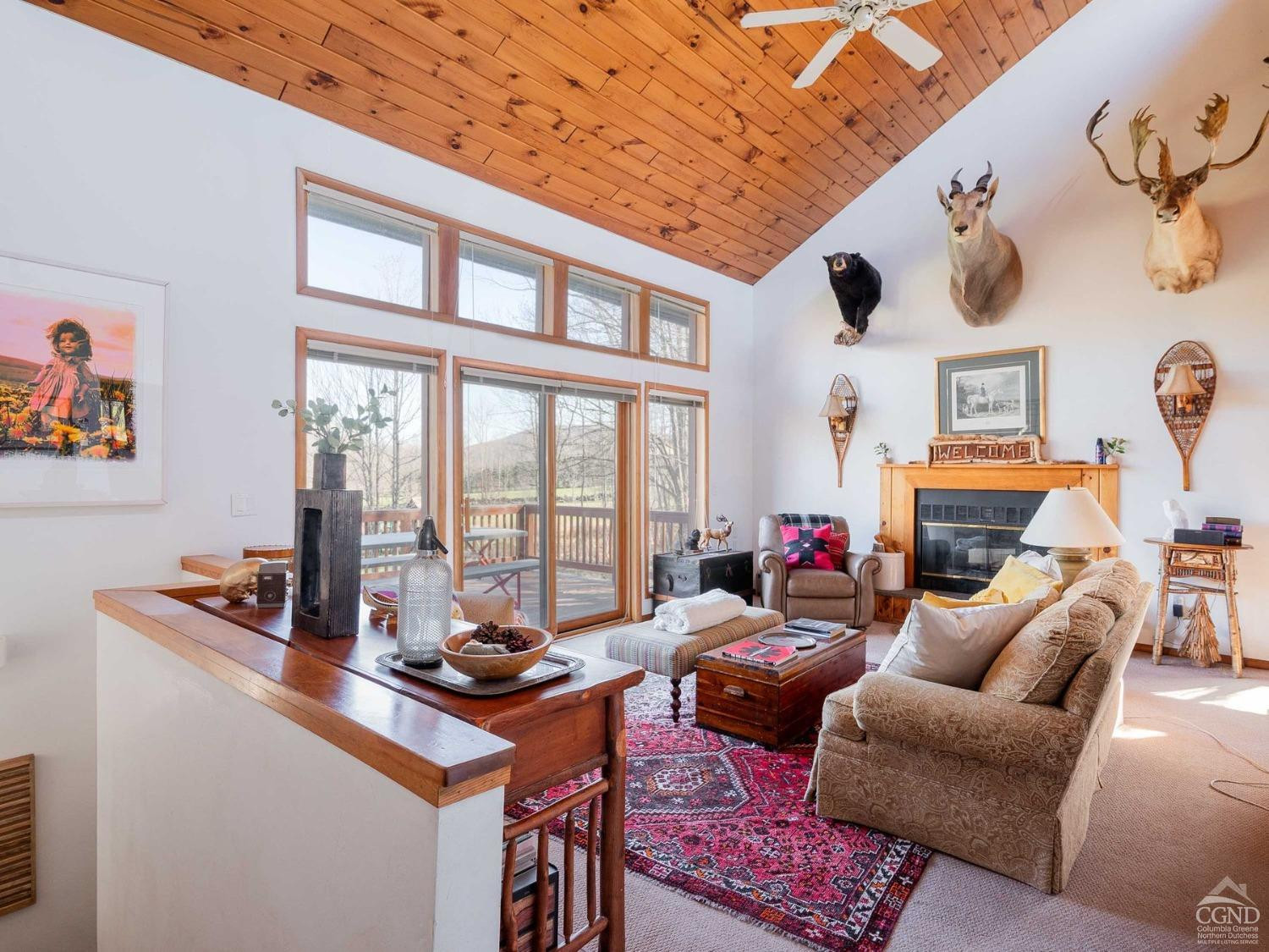266 Siam Road Windham, NY 12496 - Photo 3 of 52 a living room with furniture and a floor to ceiling window