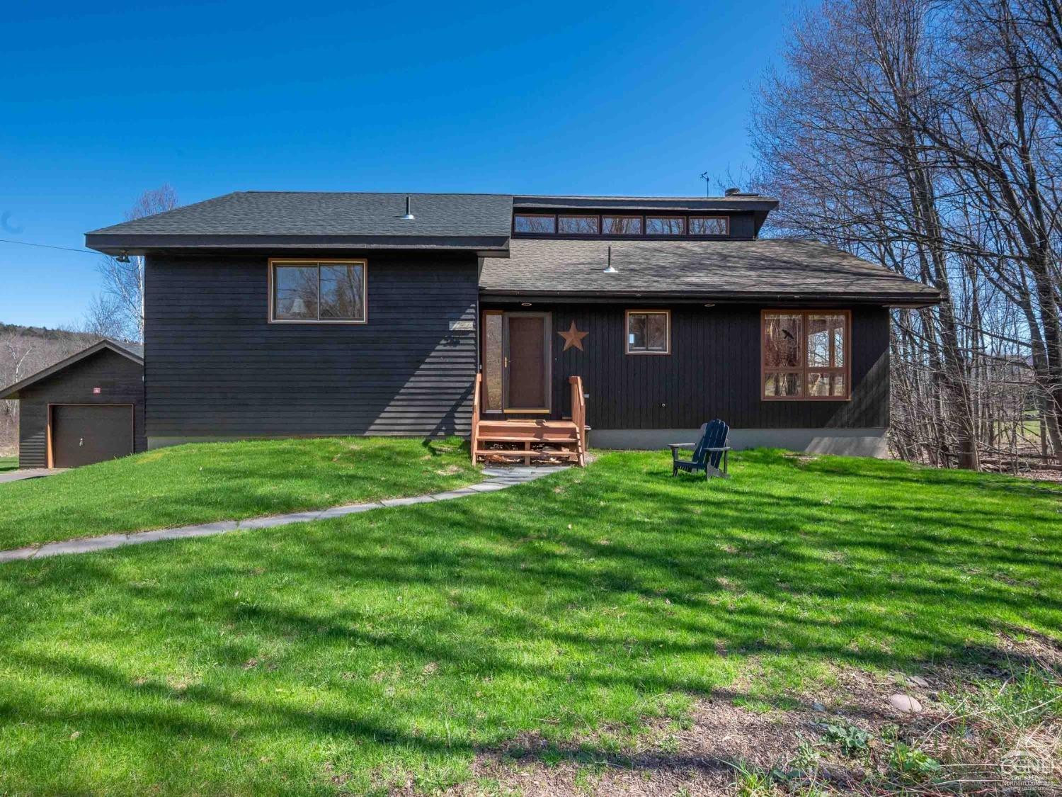 266 Siam Road Windham, NY 12496 - Photo 43 of 52 a front view of a house with a garden