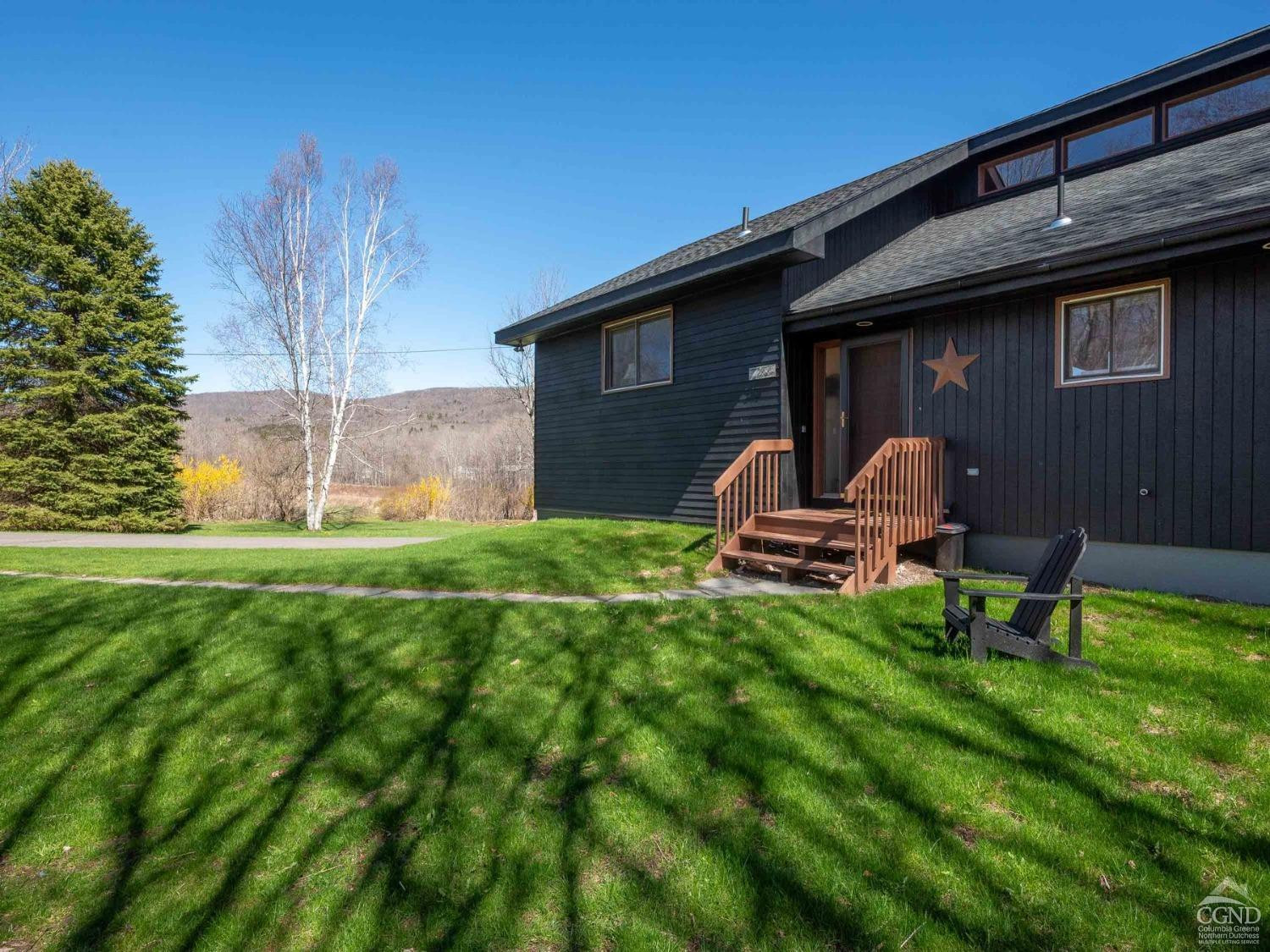 266 Siam Road Windham, NY 12496 - Photo 44 of 52 a backyard of a house with table and chairs