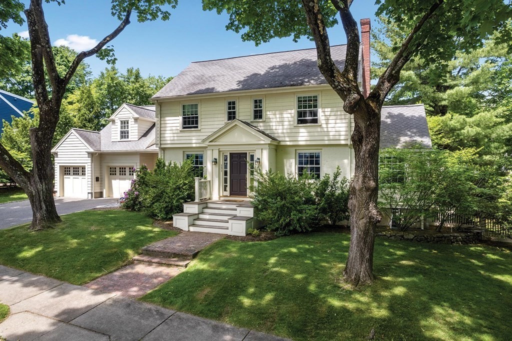 a front view of a house with a yard
