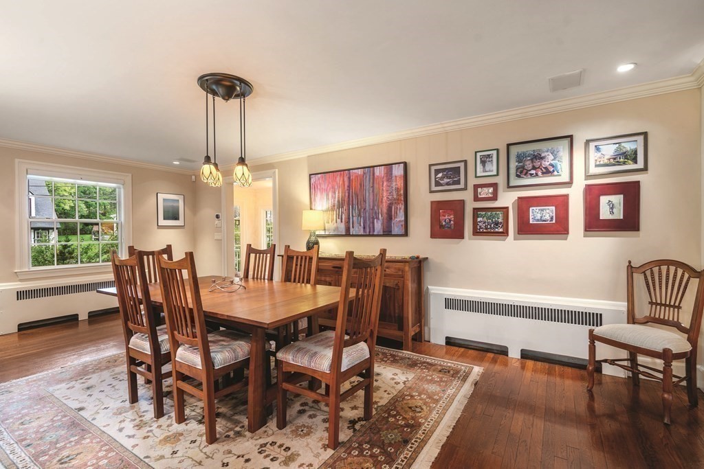 131 Oliver Road Newton, MA 02468 - Photo 14 of 41 a view of a dining room with furniture window and wooden floor