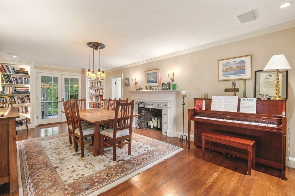 131 Oliver Road Newton, MA 02468 - Photo 15 of 41 a living room with furniture and a fireplace