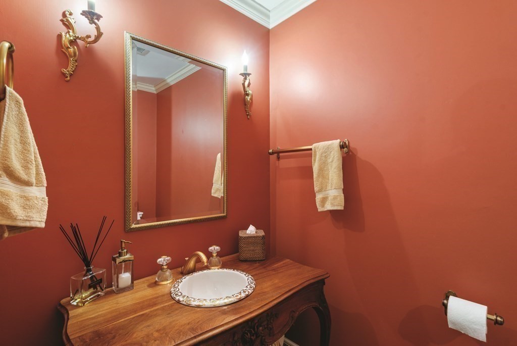 131 Oliver Road Newton, MA 02468 - Photo 18 of 41 a bathroom with a sink vanity and mirror