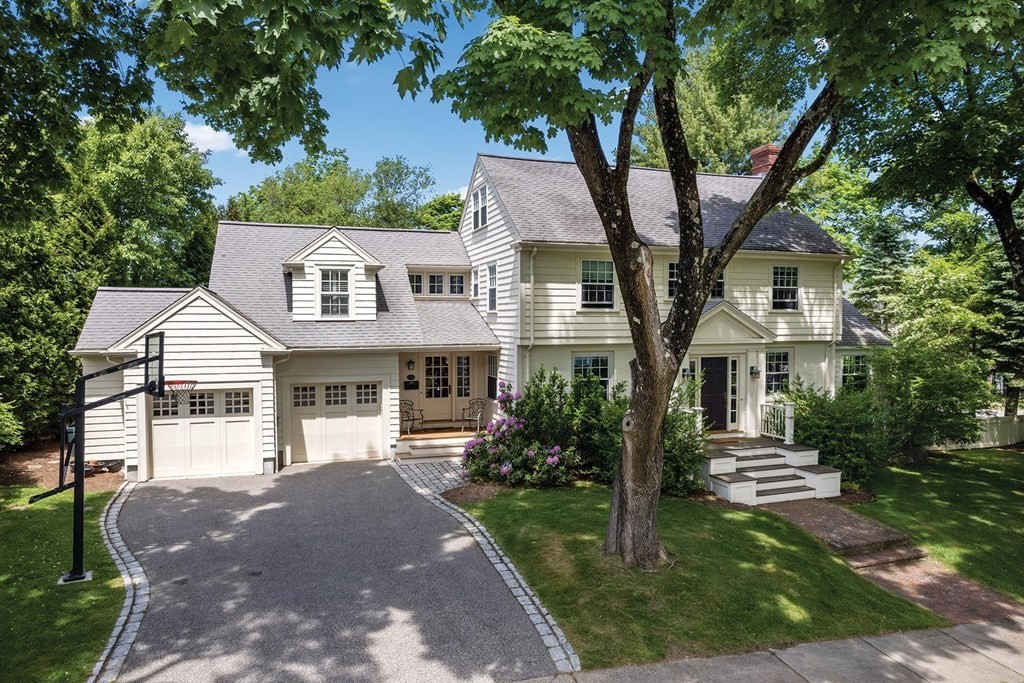 131 Oliver Road Newton, MA 02468 - Photo 2 of 41 a front view of a house with a garden
