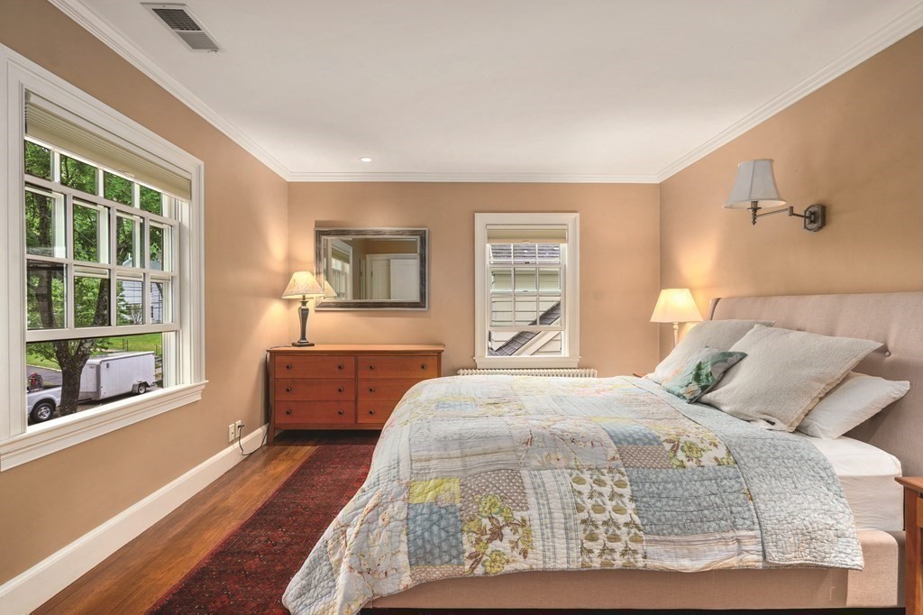 131 Oliver Road Newton, MA 02468 - Photo 28 of 41 a bedroom with a large bed and a large window