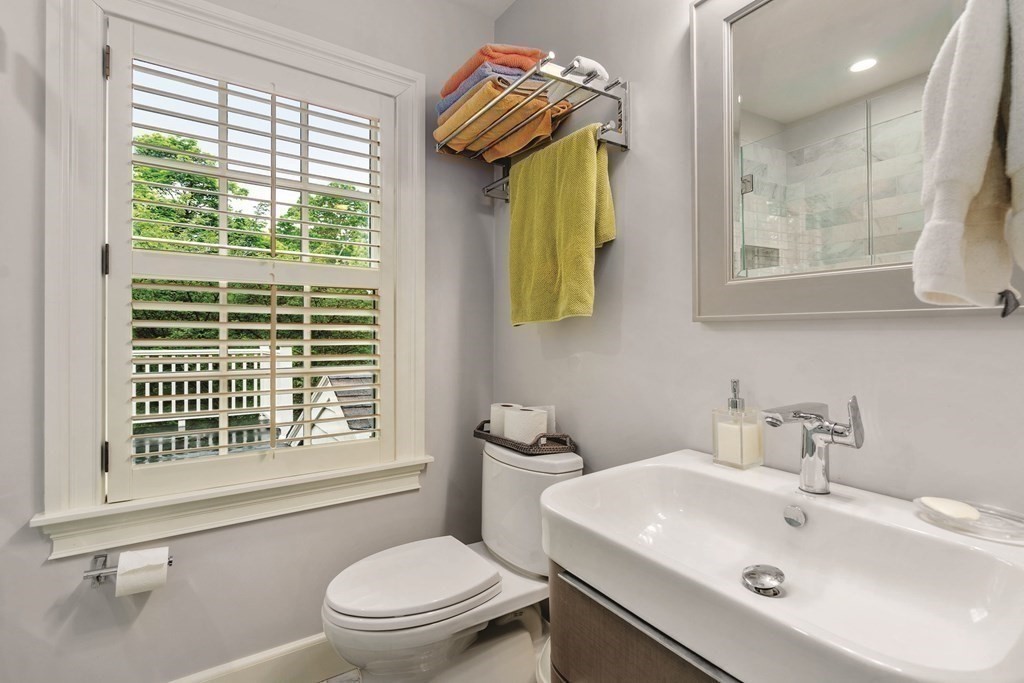 131 Oliver Road Newton, MA 02468 - Photo 29 of 41 a bathroom with a sink a toilet and a window