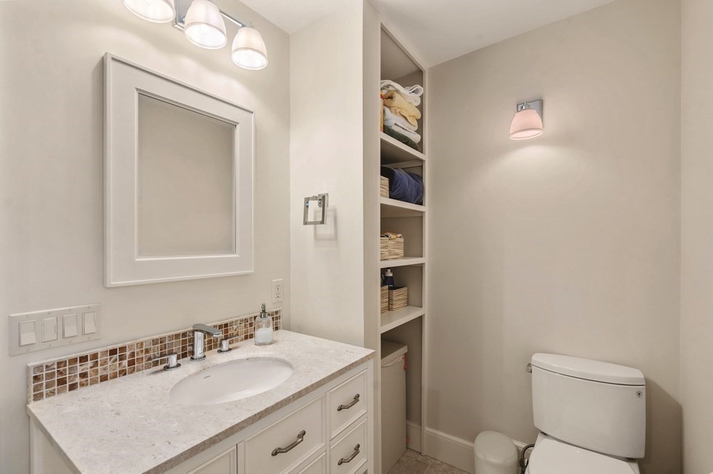 131 Oliver Road Newton, MA 02468 - Photo 30 of 41 a bathroom with a sink vanity and a toilet