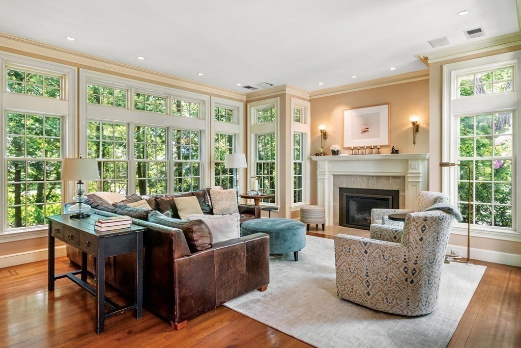 131 Oliver Road Newton, MA 02468 - Photo 3 of 41 a living room with furniture and a fireplace