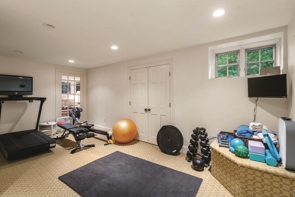 131 Oliver Road Newton, MA 02468 - Photo 35 of 41 a room with furniture and gym equipment