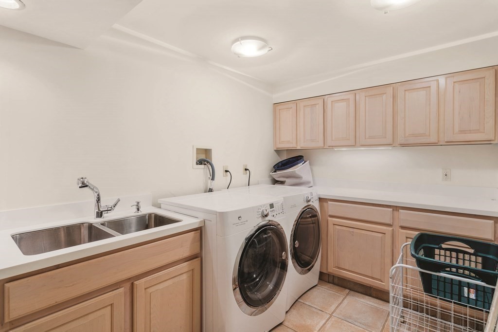 131 Oliver Road Newton, MA 02468 - Photo 37 of 41 a utility room with sink dryer and washer