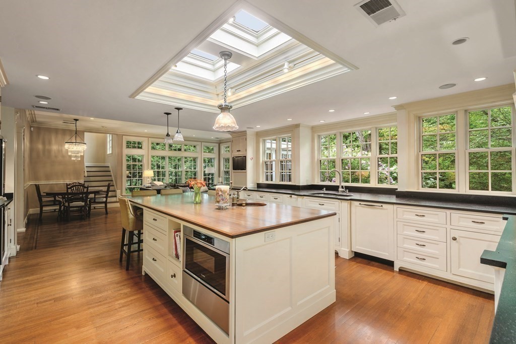 131 Oliver Road Newton, MA 02468 - Photo 6 of 41 a kitchen with stainless steel appliances granite countertop a stove and a large window
