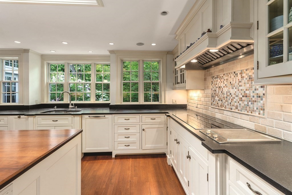 131 Oliver Road Newton, MA 02468 - Photo 8 of 41 a kitchen with a sink and large windows
