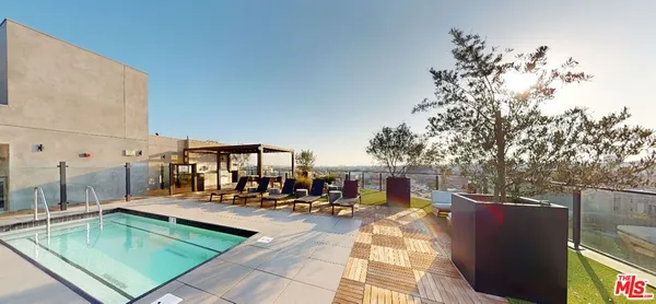 a view of a swimming pool with chairs