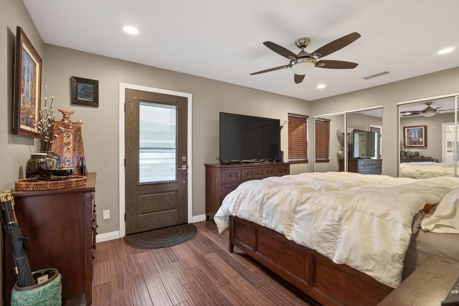 98 Mountain View Street Oak View, CA 93022 - Photo 13 of 42 a bed room with a bed a mirror and a flat tv screen