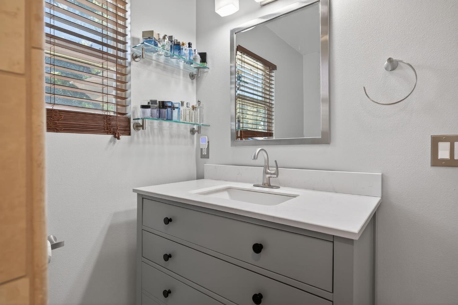 98 Mountain View Street Oak View, CA 93022 - Photo 15 of 42 a bathroom with a sink and a mirror