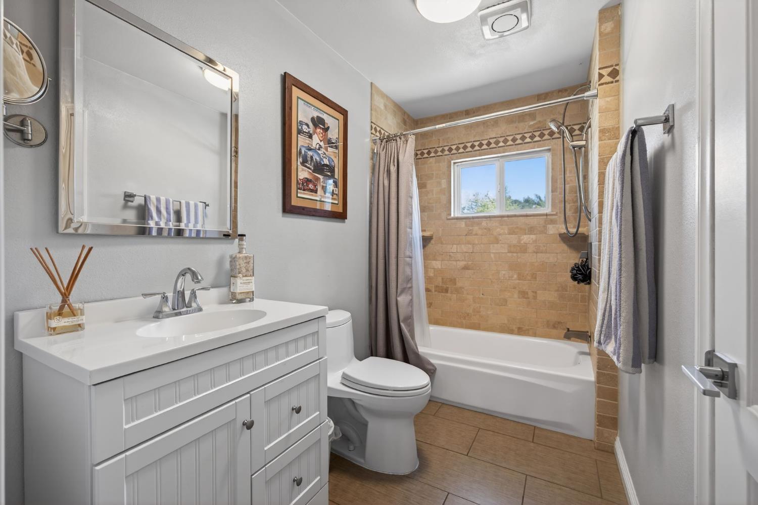 98 Mountain View Street Oak View, CA 93022 - Photo 18 of 42 a bathroom with a sink a toilet and a large mirror