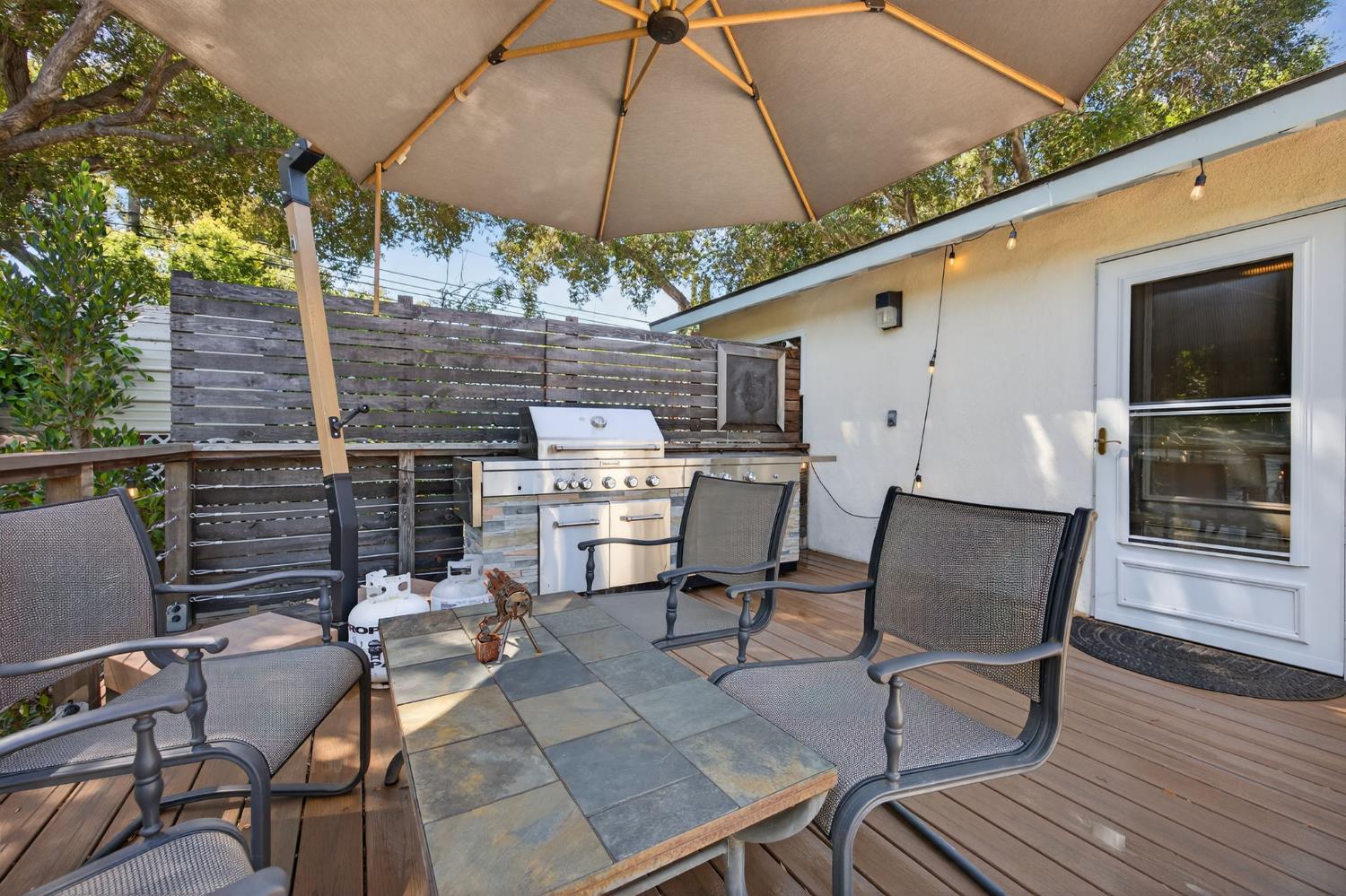98 Mountain View Street Oak View, CA 93022 - Photo 21 of 42 a patio with table and chairs