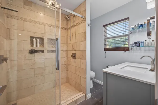 a bathroom with a double vanity sink and a mirror