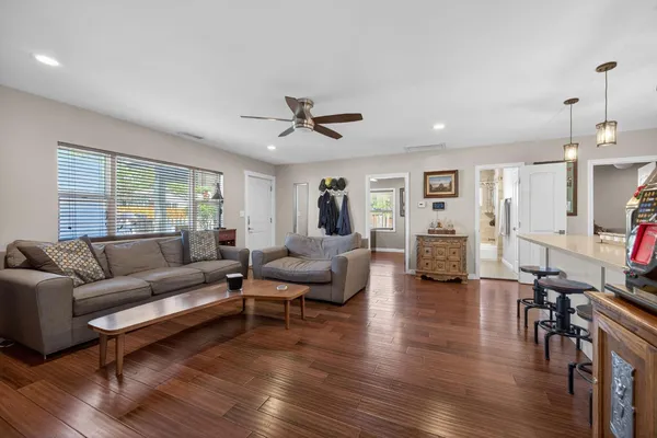 a bathroom with a granite countertop toilet sink and a bathtub