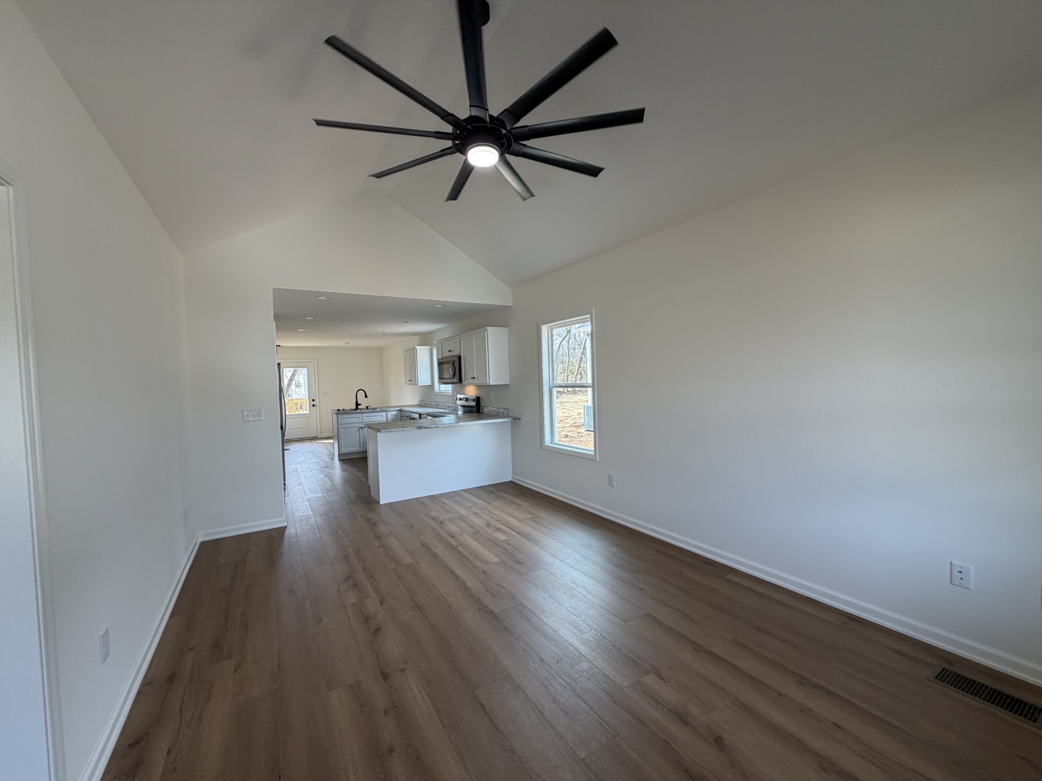 408 Church Street Portland, TN 37148 - Photo 2 of 11 wooden floor in an empty room with a window
