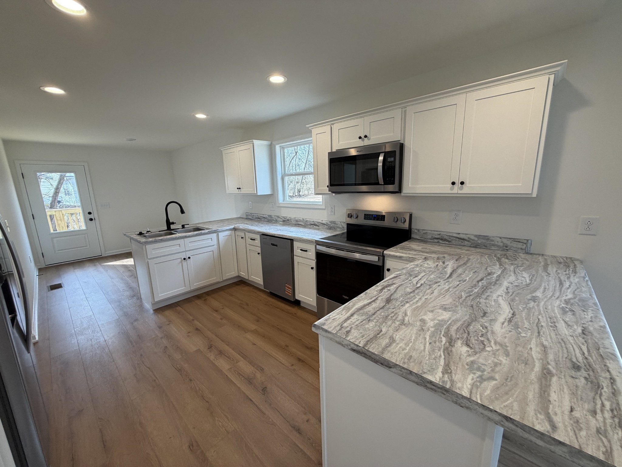 408 Church Street Portland, TN 37148 - Photo 4 of 11 a kitchen with granite countertop a sink and cabinets