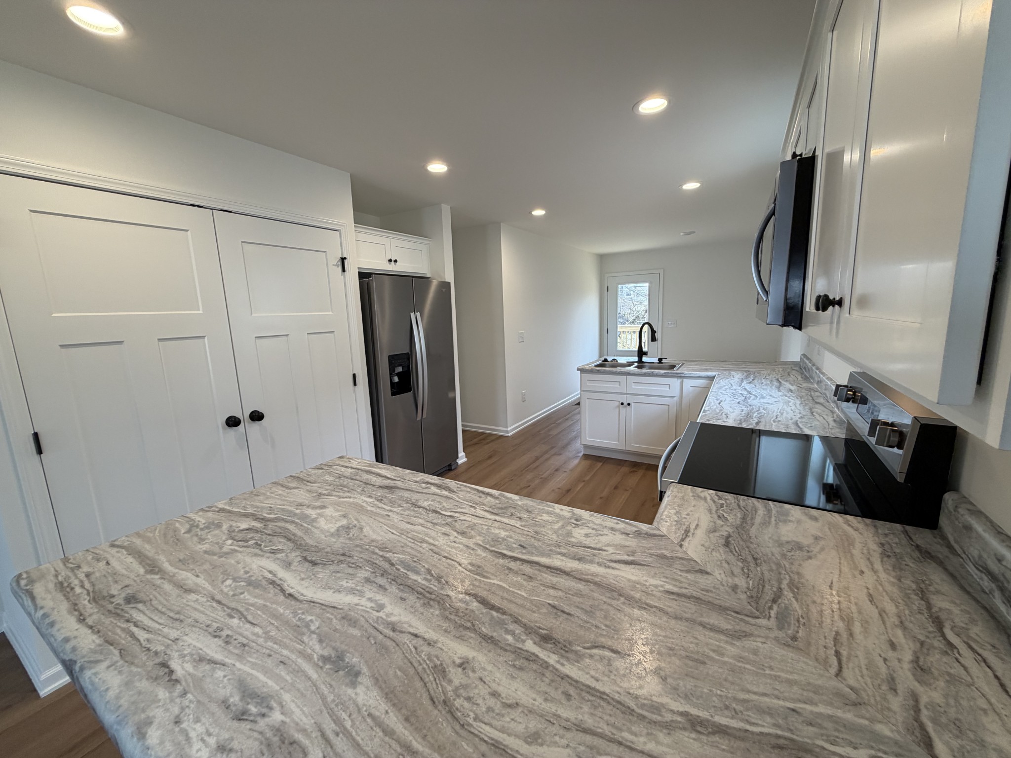408 Church Street Portland, TN 37148 - Photo 5 of 11 a large bedroom with a bed and a large mirror