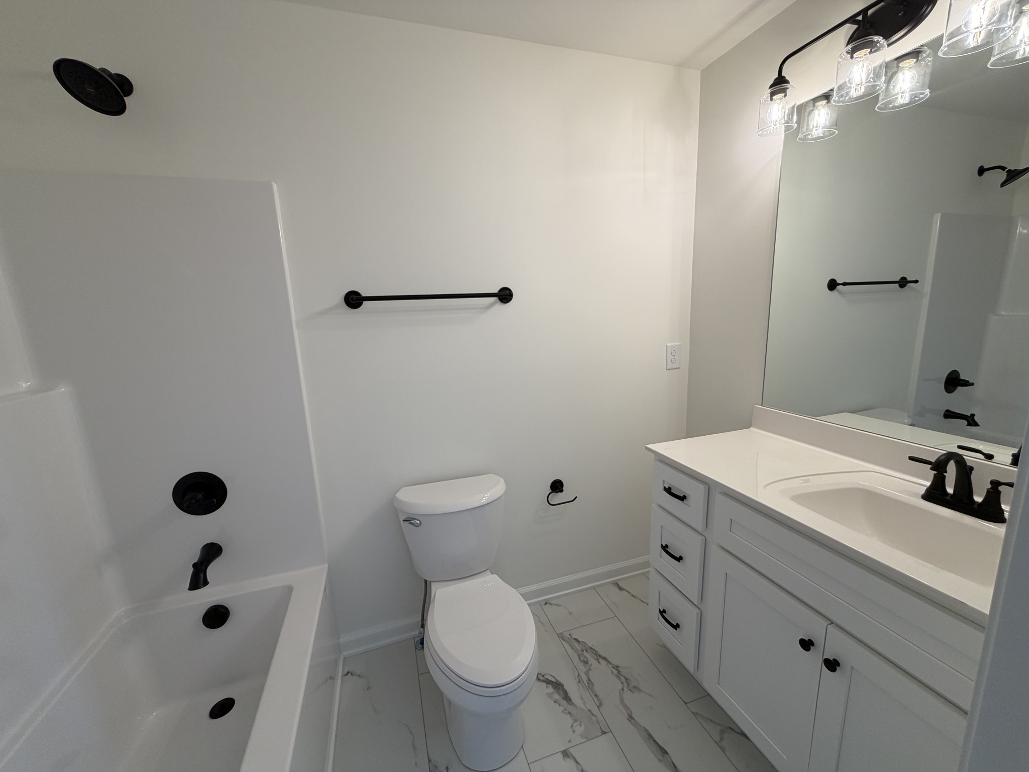 408 Church Street Portland, TN 37148 - Photo 8 of 11 a bathroom with a sink a toilet and shower