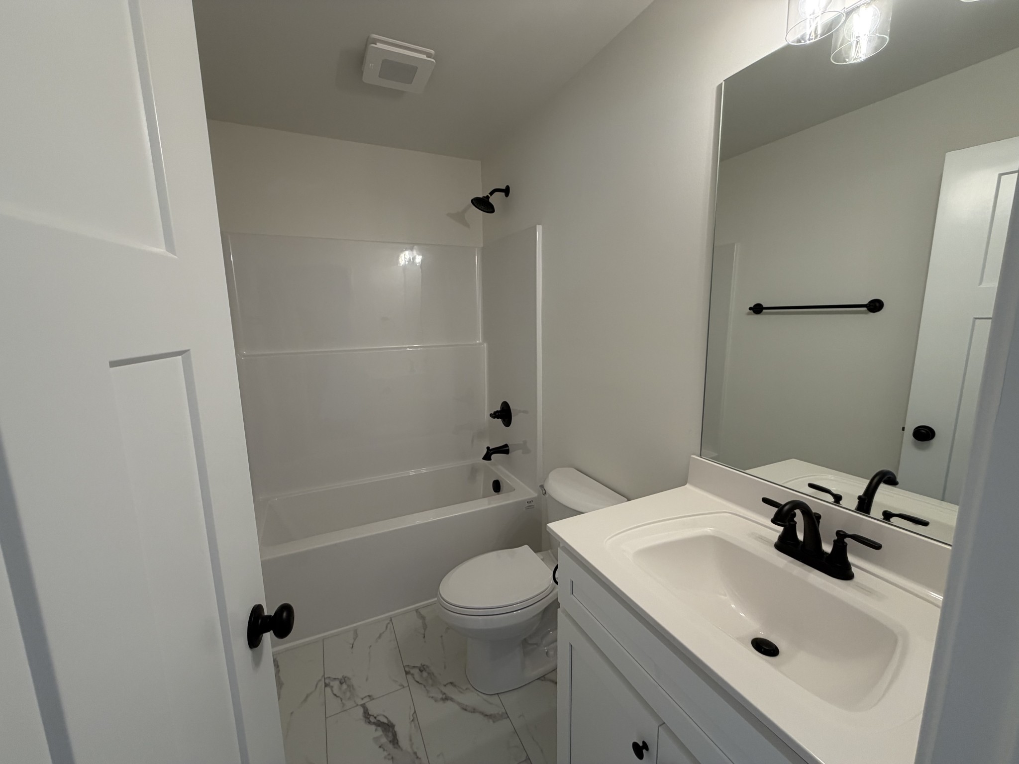 408 Church Street Portland, TN 37148 - Photo 10 of 11 a bathroom with a sink toilet tub and shower