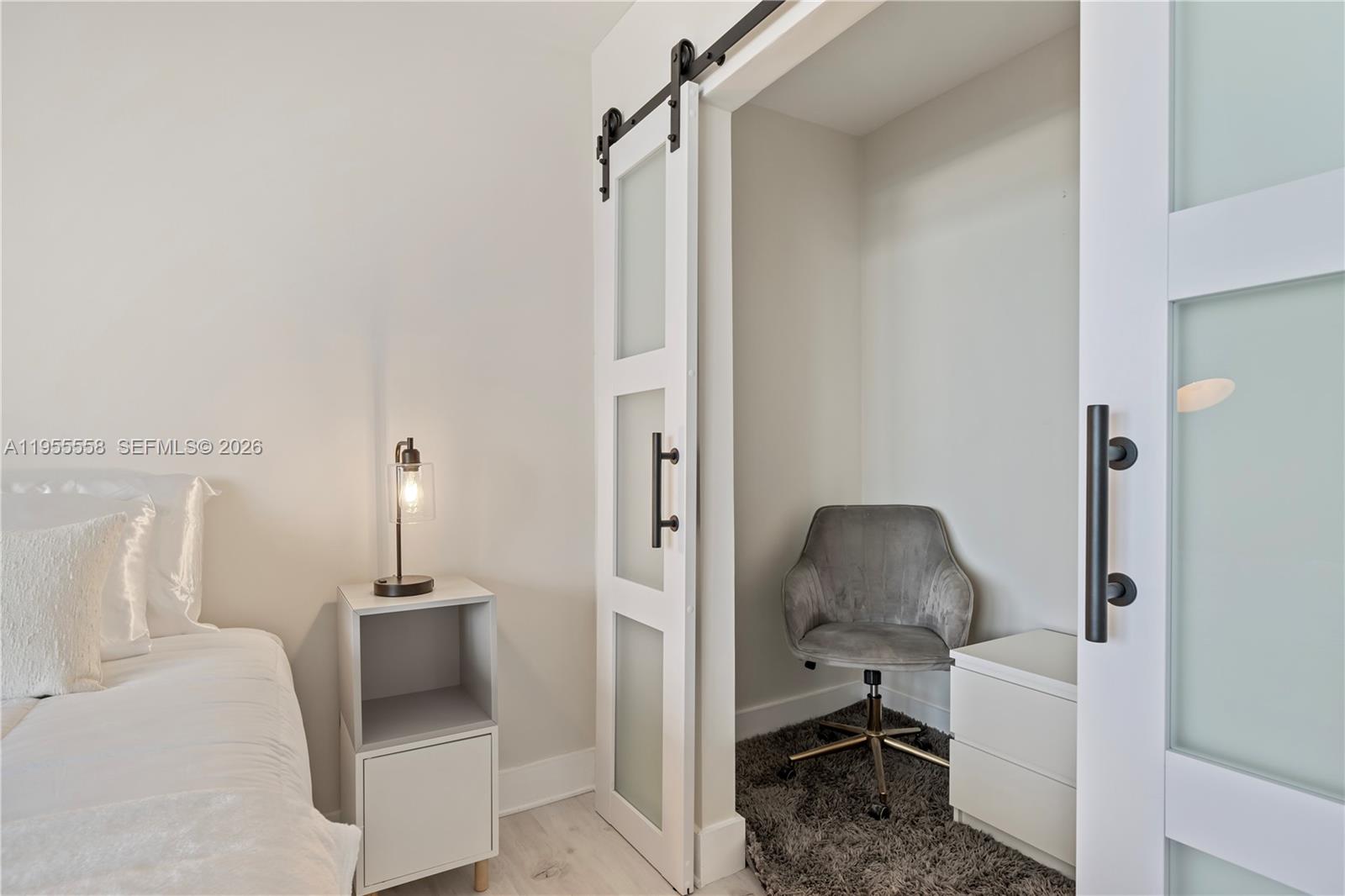 2301 Collins Avenue, Unit 1130 Miami Beach, FL 33139 - Photo 12 of 29 a living room with furniture and a chair