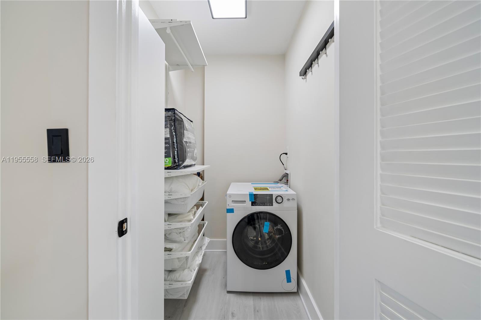 2301 Collins Avenue, Unit 1130 Miami Beach, FL 33139 - Photo 14 of 29 a view of a storage & utility room with washer and dryer