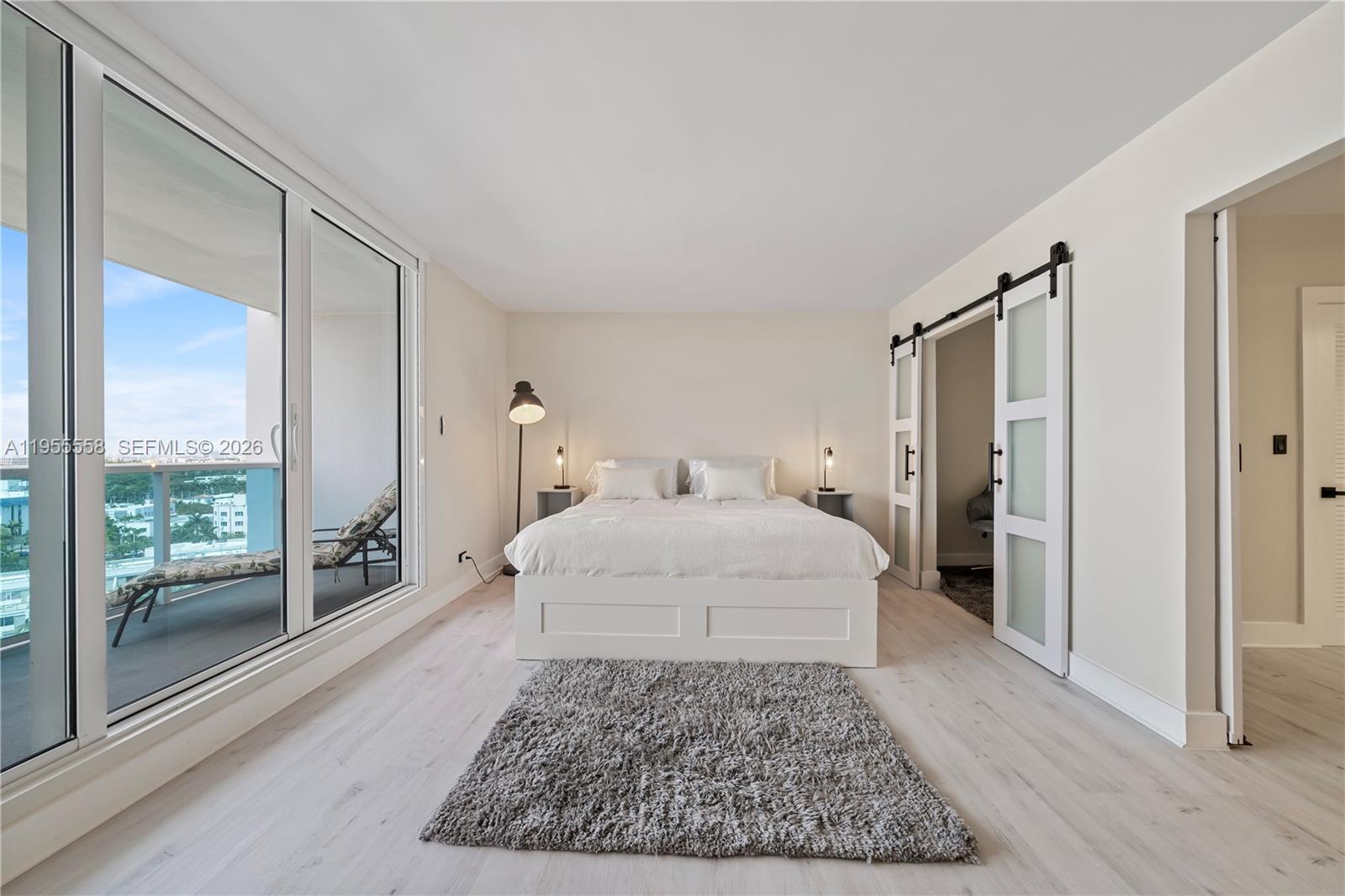 2301 Collins Avenue, Unit 1130 Miami Beach, FL 33139 - Photo 9 of 29 a large white bed in a white room