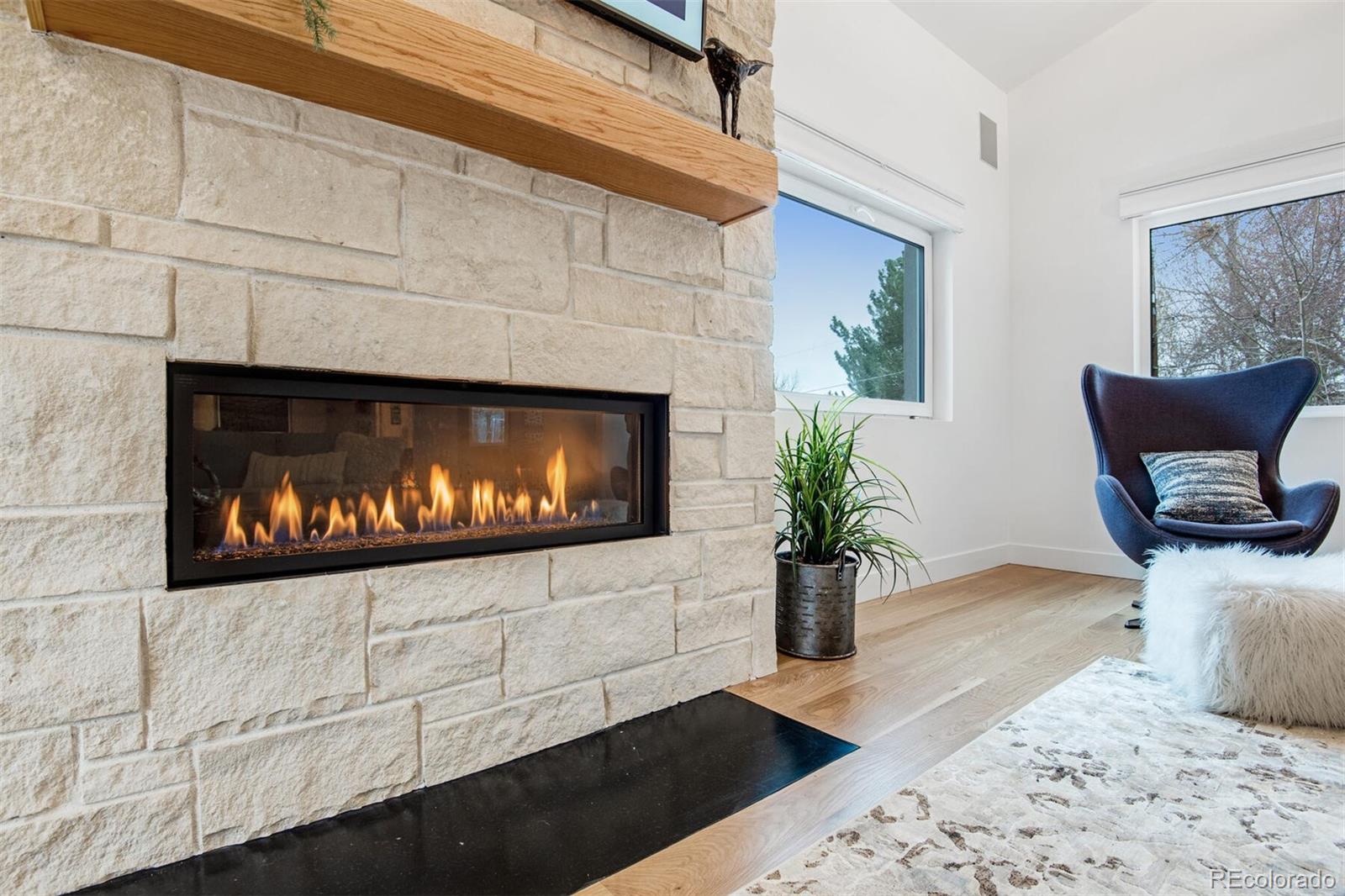 500 Iris Avenue Boulder, CO 80304 - Photo 12 of 39 a living room with furniture and a fireplace