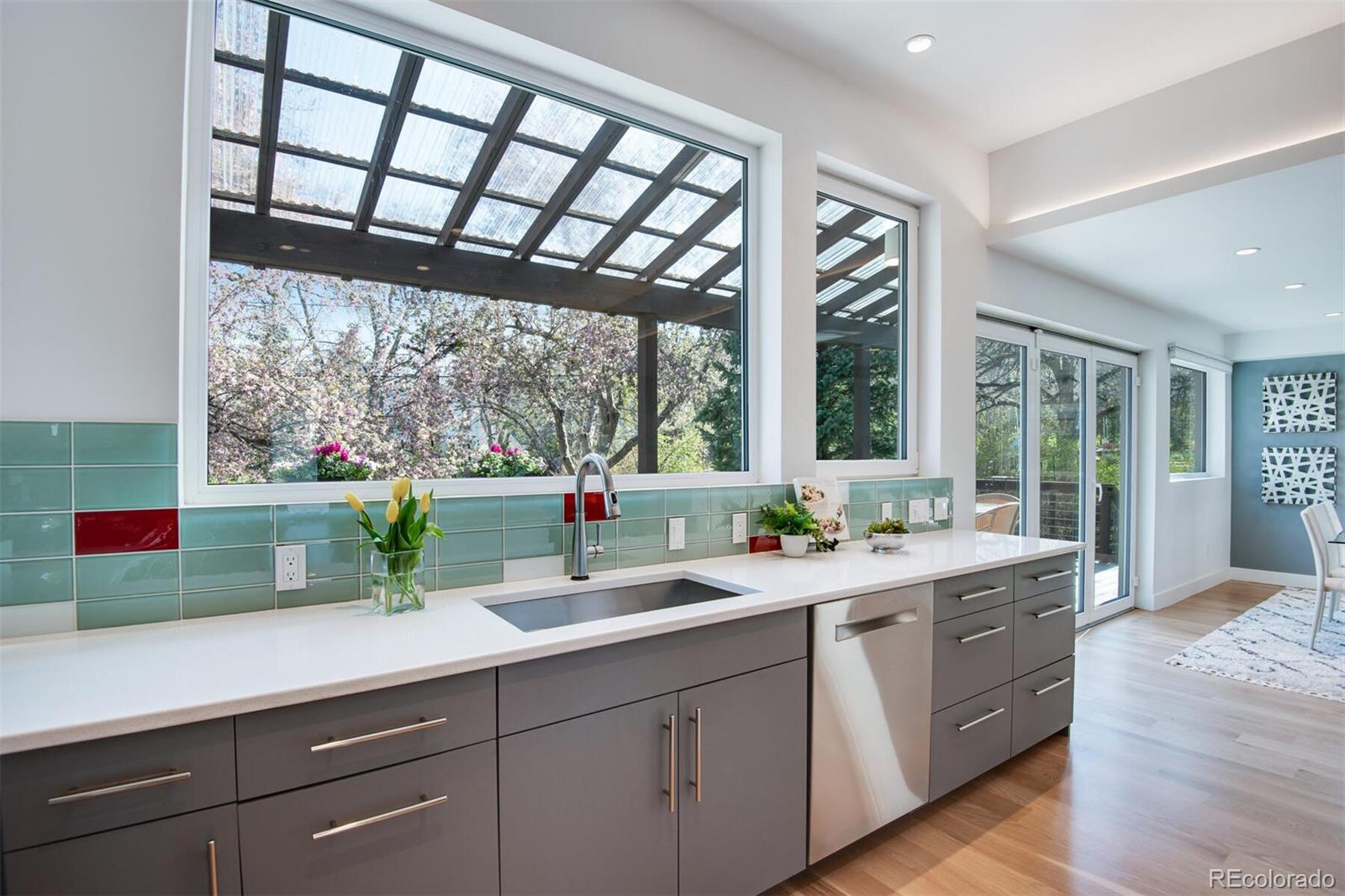 500 Iris Avenue Boulder, CO 80304 - Photo 16 of 39 a kitchen with a sink and wooden floor