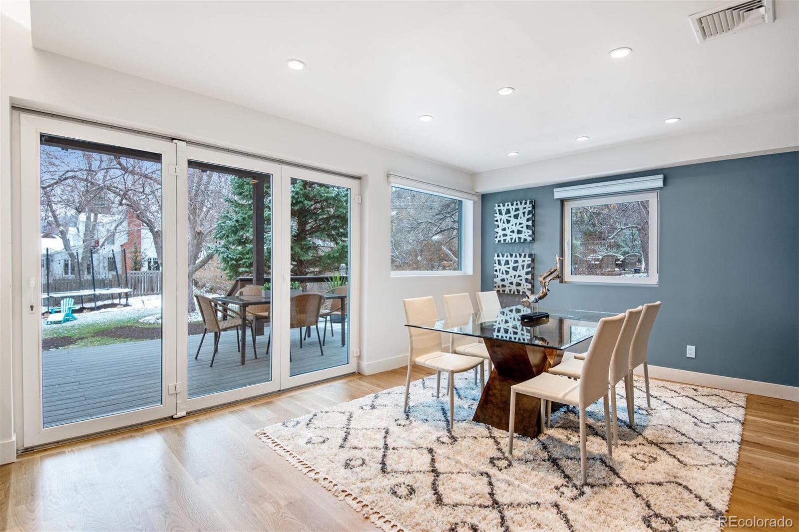 500 Iris Avenue Boulder, CO 80304 - Photo 19 of 39 a dining room with wooden floor and glass door