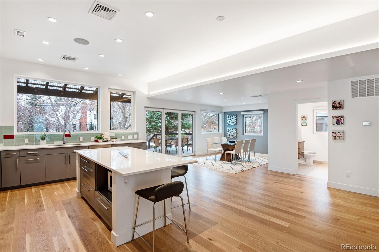 500 Iris Avenue Boulder, CO 80304 - Photo 20 of 39 an open kitchen with a sink and chairs