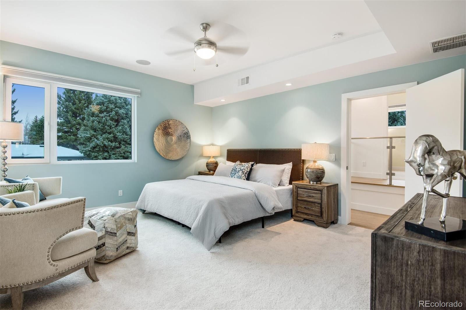 500 Iris Avenue Boulder, CO 80304 - Photo 23 of 39 a bed room with a bed and a chandelier