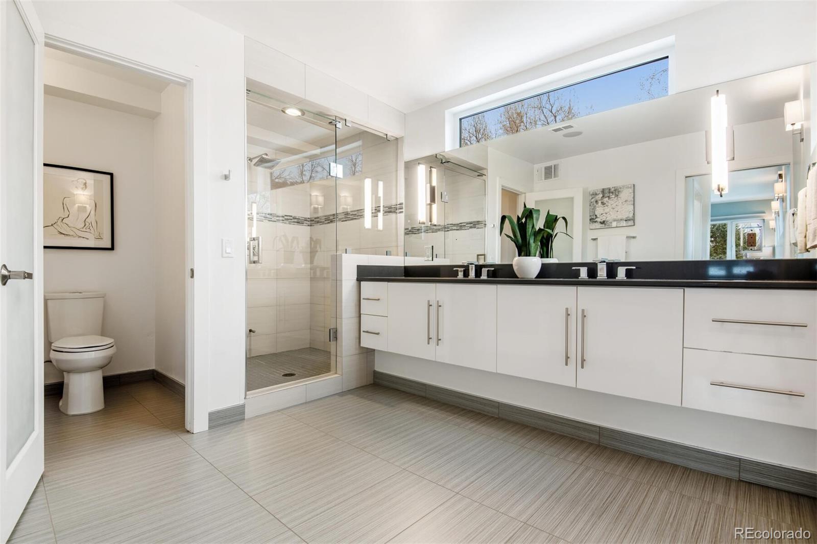 500 Iris Avenue Boulder, CO 80304 - Photo 28 of 39 a bathroom with a granite countertop sink mirror and toilet