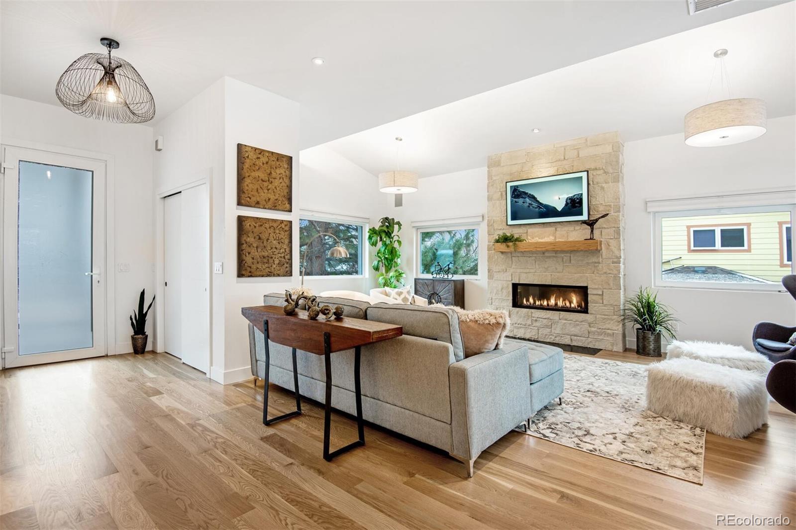 500 Iris Avenue Boulder, CO 80304 - Photo 7 of 39 a living room with furniture and a fireplace