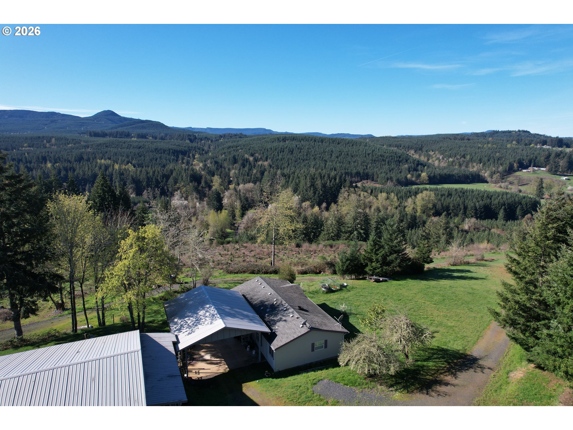 42255 Ames Creek Road Sweet Home, OR 97386 - Photo 1 of 19 an aerial view of a house with mountain view