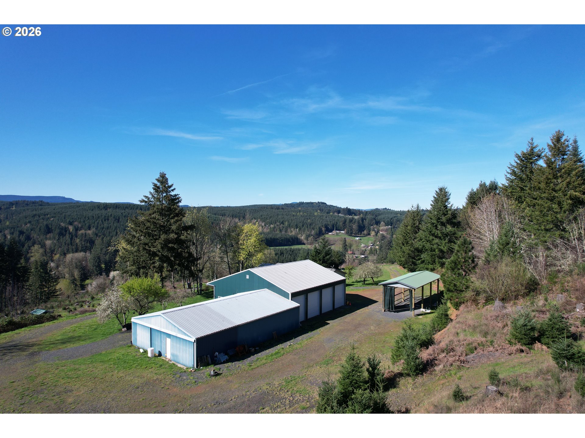42255 Ames Creek Road Sweet Home, OR 97386 - Photo 2 of 19 a view of a big house with a big yard